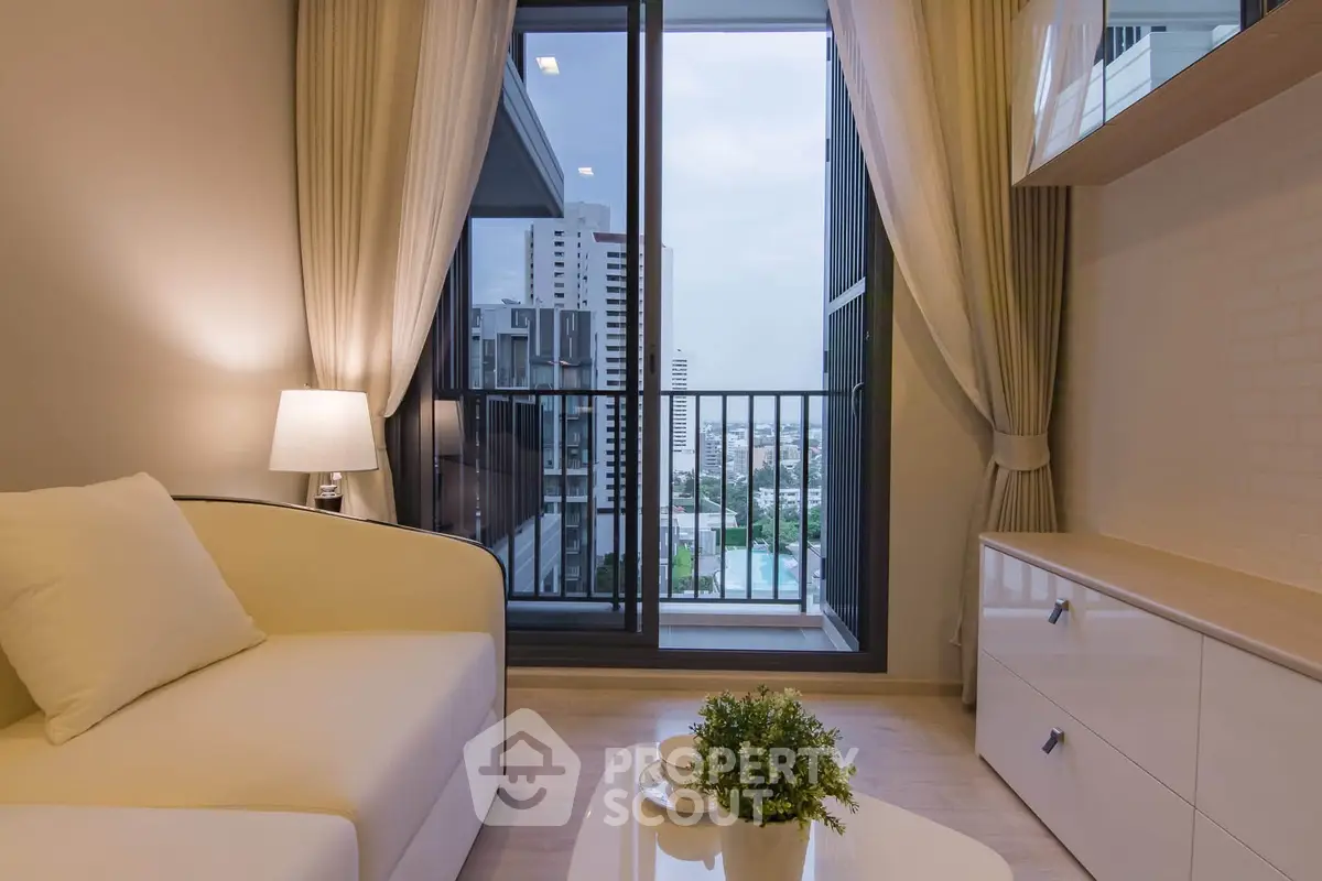 Modern living room with balcony view in high-rise apartment