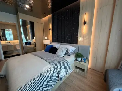 Modern bedroom with stylish decor and cozy ambiance, featuring wooden accents and elegant lighting.