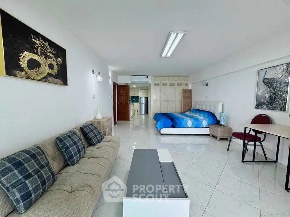 Spacious studio apartment with modern decor and ample natural light