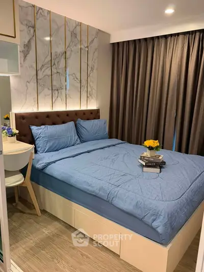 Luxurious bedroom with elegant decor and cozy ambiance, featuring a plush bed and stylish furnishings.