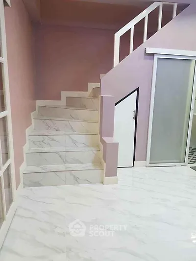 Modern interior with marble staircase and sleek sliding door design