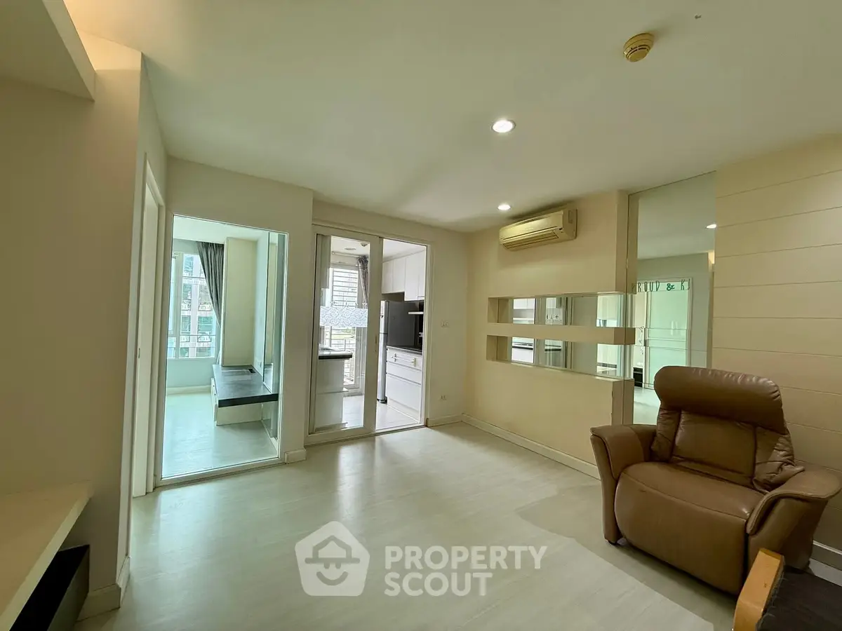 Spacious modern living room with sleek design and ample natural light