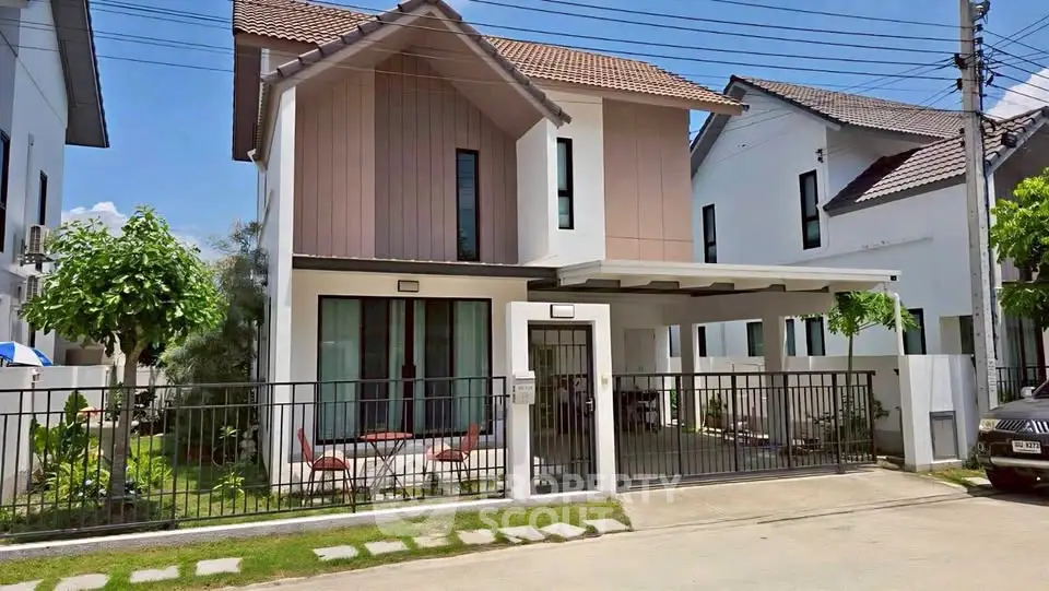 Charming modern two-story house with spacious driveway and lush garden in a serene neighborhood.