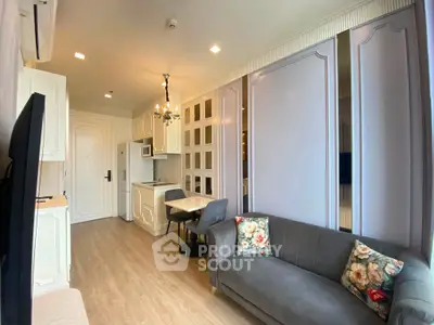 Charming living room with elegant decor and cozy seating in modern apartment