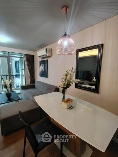 Modern living room with stylish decor and elegant lighting in a contemporary apartment.