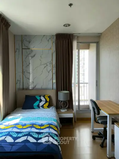 Modern bedroom with stylish decor and balcony access in urban apartment