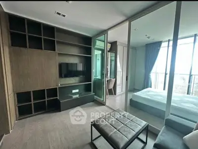 Modern living room with sleek design and large windows offering natural light