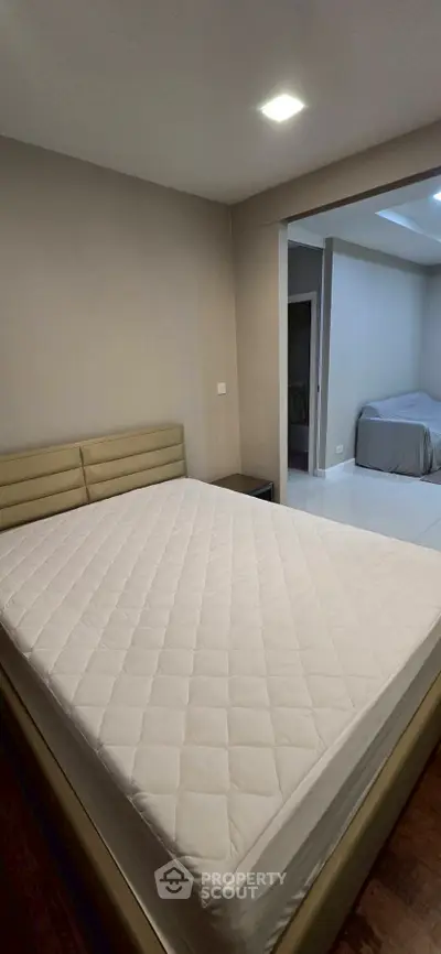 Spacious bedroom with modern design and comfortable bed