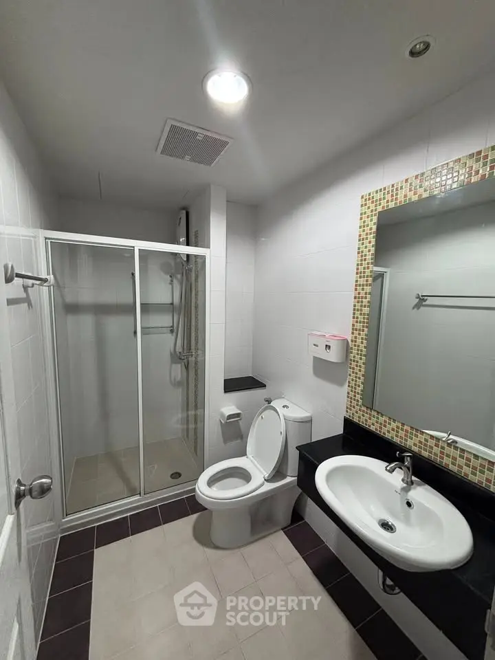 Modern bathroom with glass shower and stylish sink area