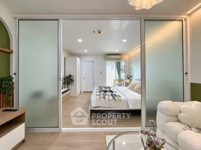 Modern bedroom with sliding glass doors and cozy decor