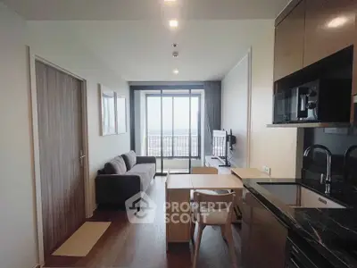 Modern apartment living room with open kitchen and stunning city view.