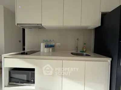 Modern kitchen with sleek cabinetry and built-in appliances