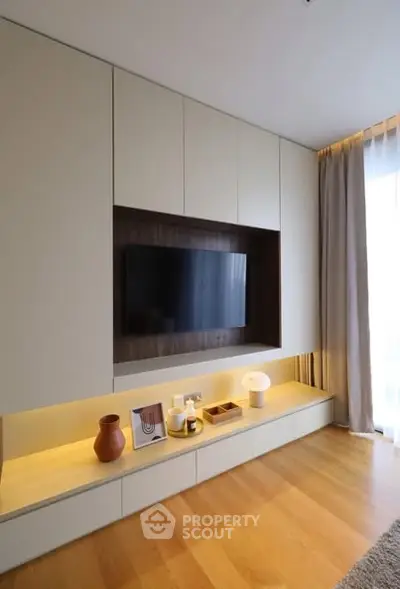 Modern living room with built-in TV unit and elegant decor