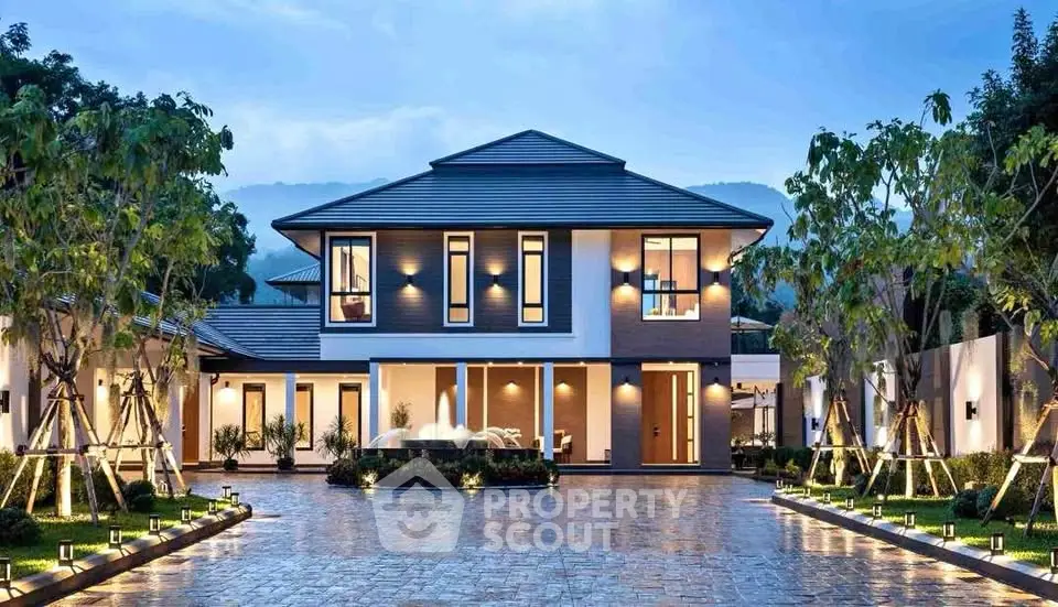 Luxurious modern two-story house with elegant driveway and lush landscaping