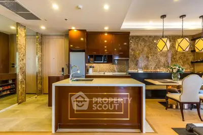 Luxurious kitchen with elegant dining area and modern lighting fixtures