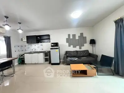 Spacious modern living room with open kitchen and stylish decor