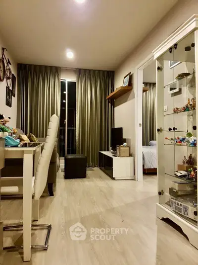 Modern living room with elegant decor and open layout, featuring a cozy seating area and stylish furnishings.