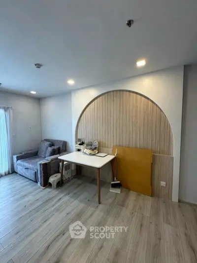 Modern living room with stylish arch design and cozy seating area