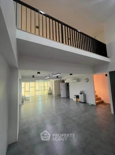 Spacious modern living room with mezzanine and sleek design