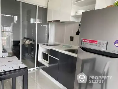 Sleek modern kitchen with high-end appliances, glossy cabinets, and a spacious layout, perfect for culinary enthusiasts.