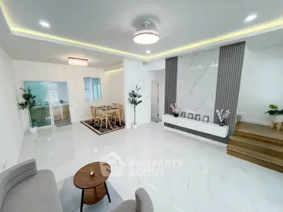Spacious modern living room with elegant dining area and stylish decor