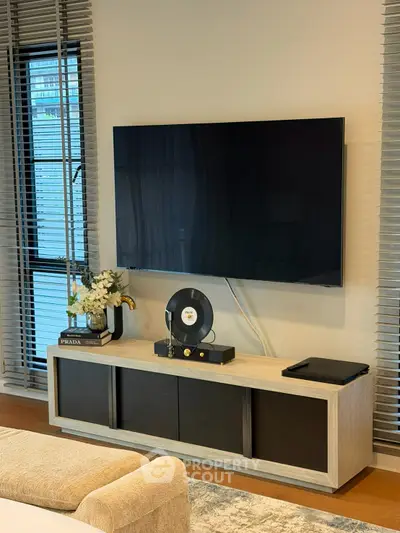Modern living room with sleek TV setup and stylish decor