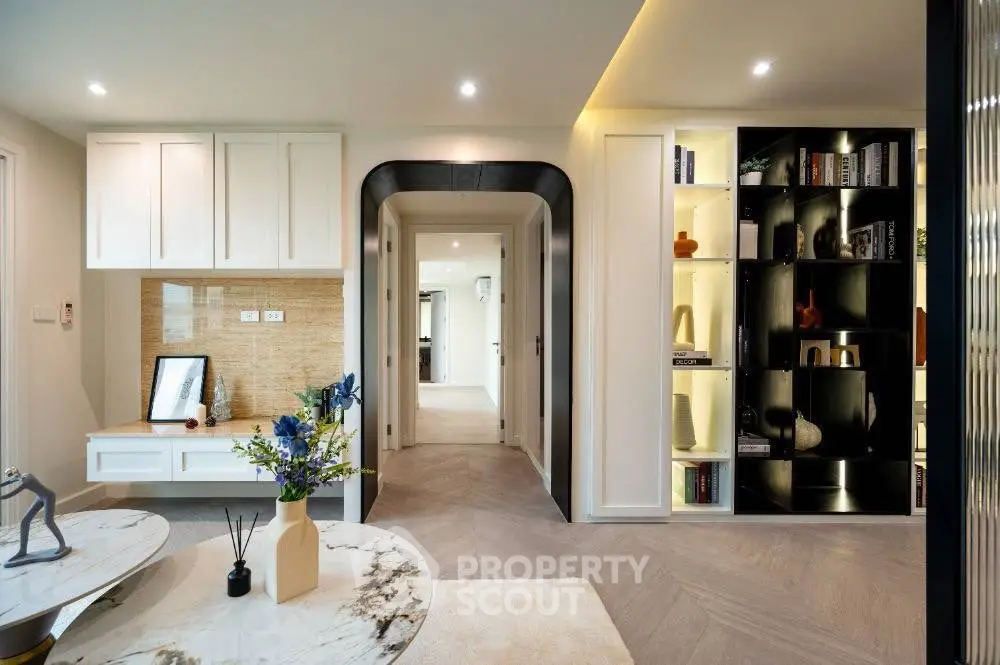 Modern living room with elegant decor and built-in shelving