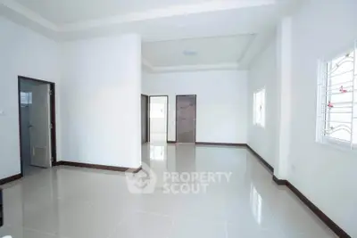 Spacious and bright interior with modern tile flooring and large windows