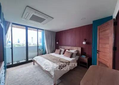 Spacious bedroom with city view and modern decor