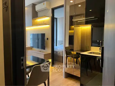 Modern apartment interior with sleek design and cozy ambiance, featuring a stylish living area and bedroom.