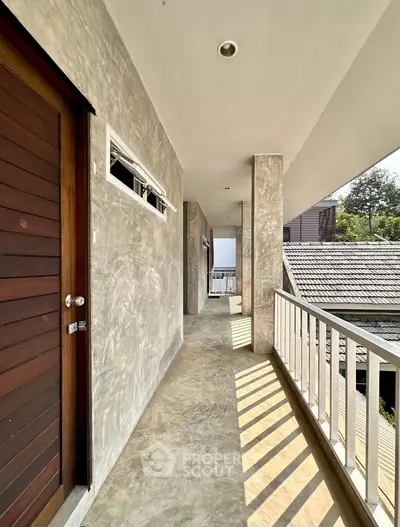 Spacious balcony with modern design and natural light, offering a serene outdoor experience.