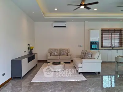 Spacious modern living room with elegant furniture and marble flooring