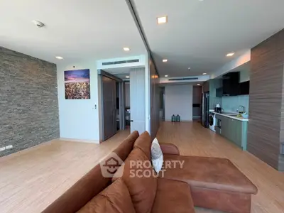 Spacious modern living room with open kitchen and stylish decor