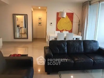 Spacious living room with modern decor and large window for natural light.