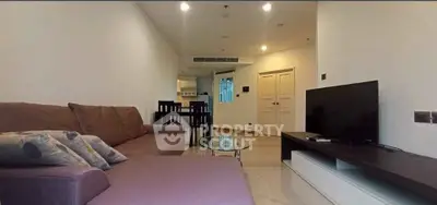 Spacious living room with modern furniture and open layout, perfect for relaxation and entertainment.