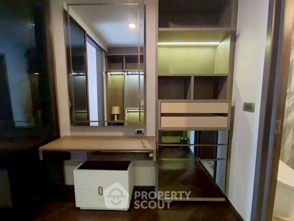Modern storage area with sleek design and ample shelving in luxury apartment.
