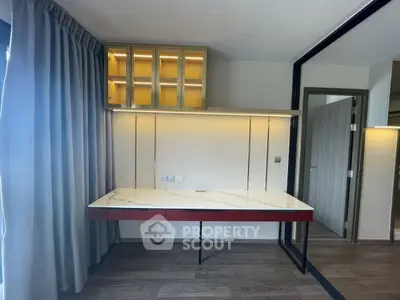Modern study area with sleek desk and built-in storage, perfect for productivity.