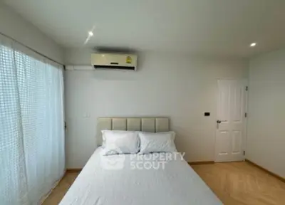 Cozy bedroom with modern air conditioning and soft lighting