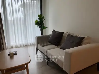 Modern living room with cozy sofa and natural light