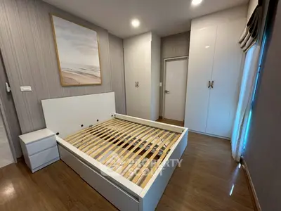 Spacious bedroom with modern design and ample storage space