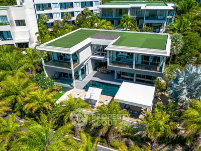 Luxurious modern villa with private pool and lush garden in tropical paradise.