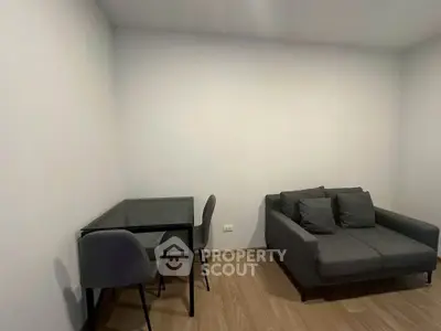 Modern minimalist living room with sleek furniture and wooden flooring