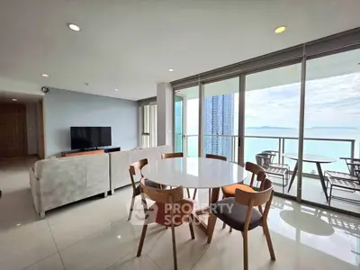 Stunning living room with ocean view and modern furniture in high-rise apartment