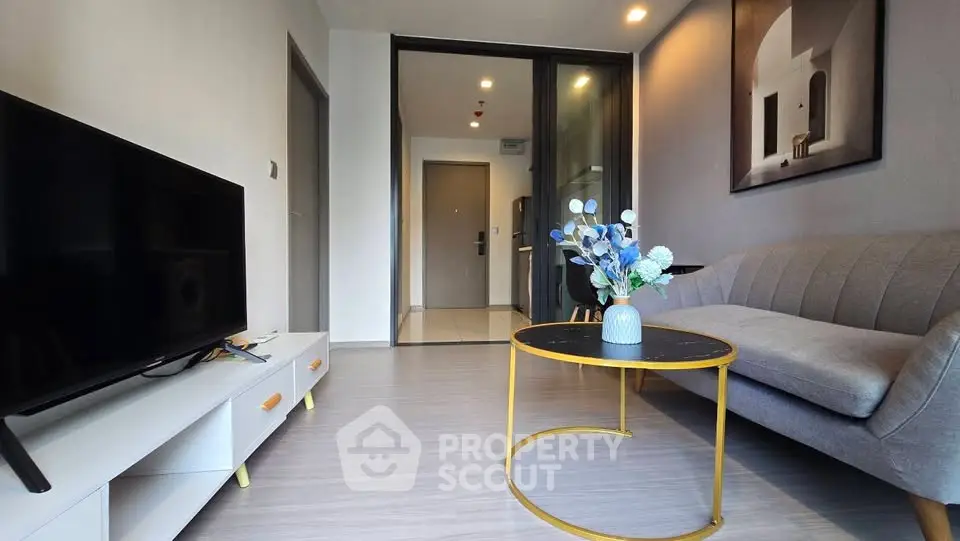 Modern living room with sleek furniture and stylish decor in a contemporary apartment.