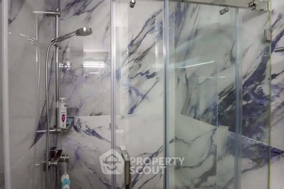 Elegant bathroom with marble shower and modern fixtures