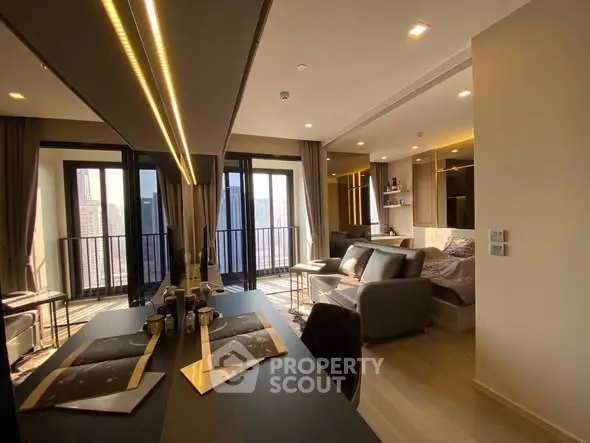 Modern studio apartment with stylish interior and city view balcony.