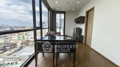 Modern living room with panoramic city view and sleek wooden flooring