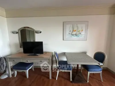 Charming living area with elegant furniture and wall art, perfect for relaxation and entertainment.
