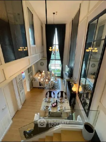 Luxurious duplex living room with high ceilings and elegant decor