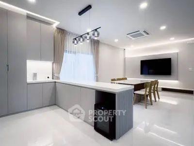 Modern kitchen and dining area with sleek design and ambient lighting